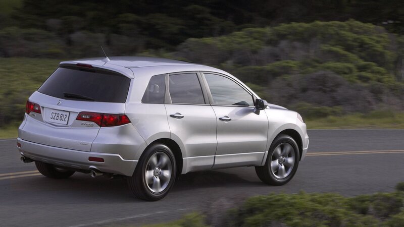 silver acura rdx driving on road