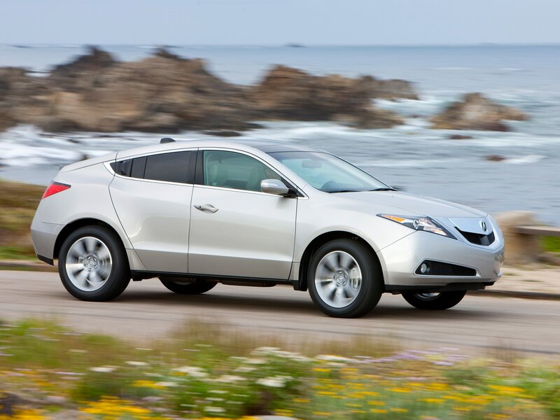 Silver Acura RDX on coastal road