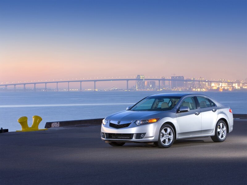 Silver Acura TL by the water