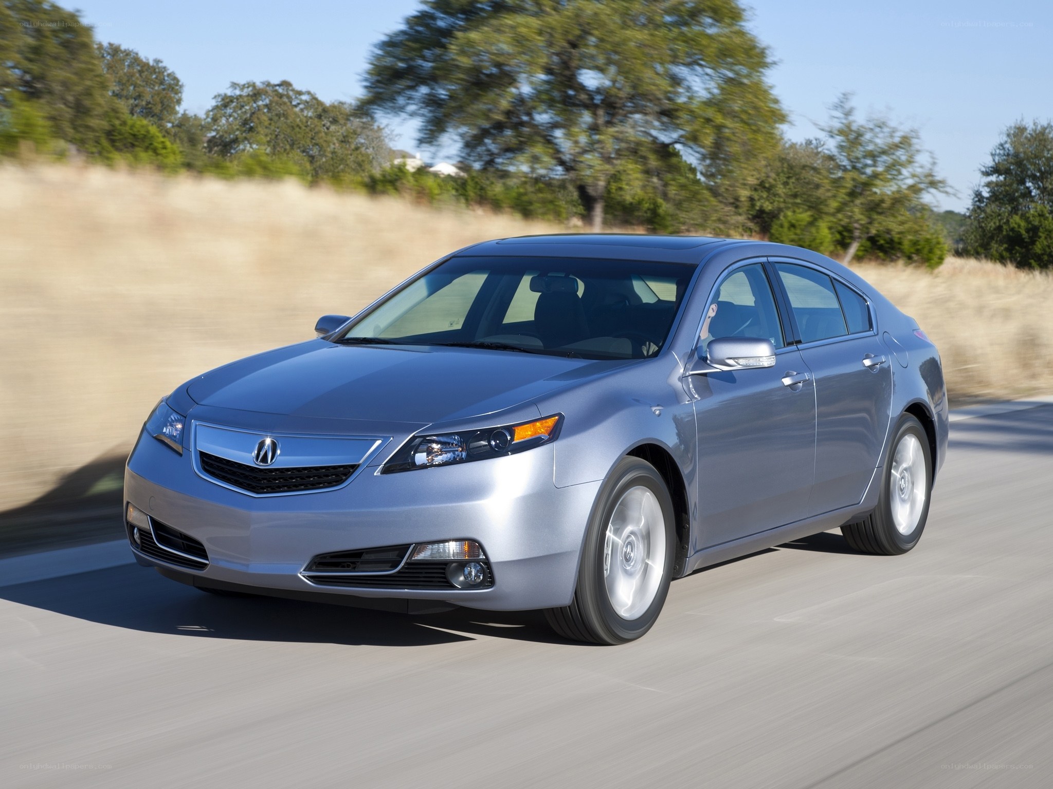 silver acura tl driving on road