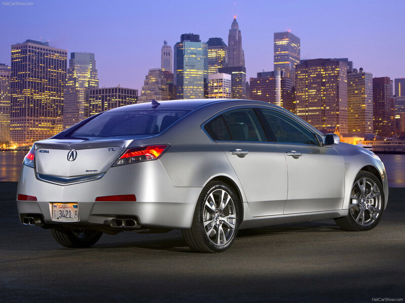 Silver Acura TL in city