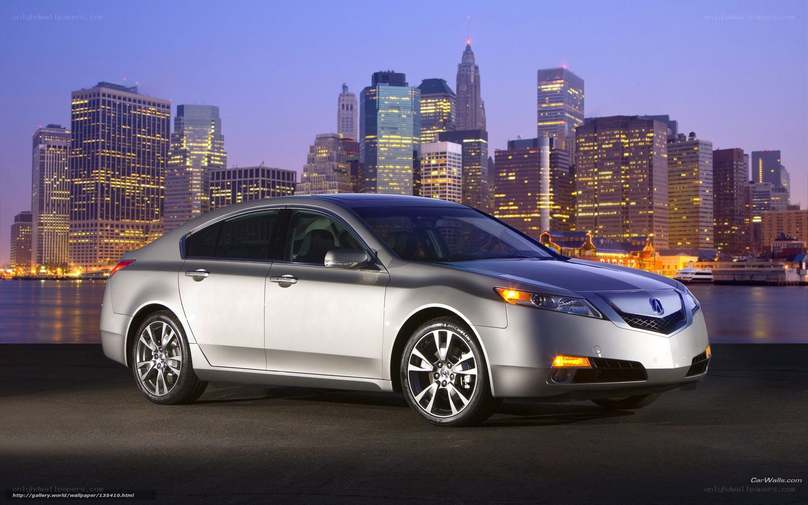Silver Acura TL in cityscape
