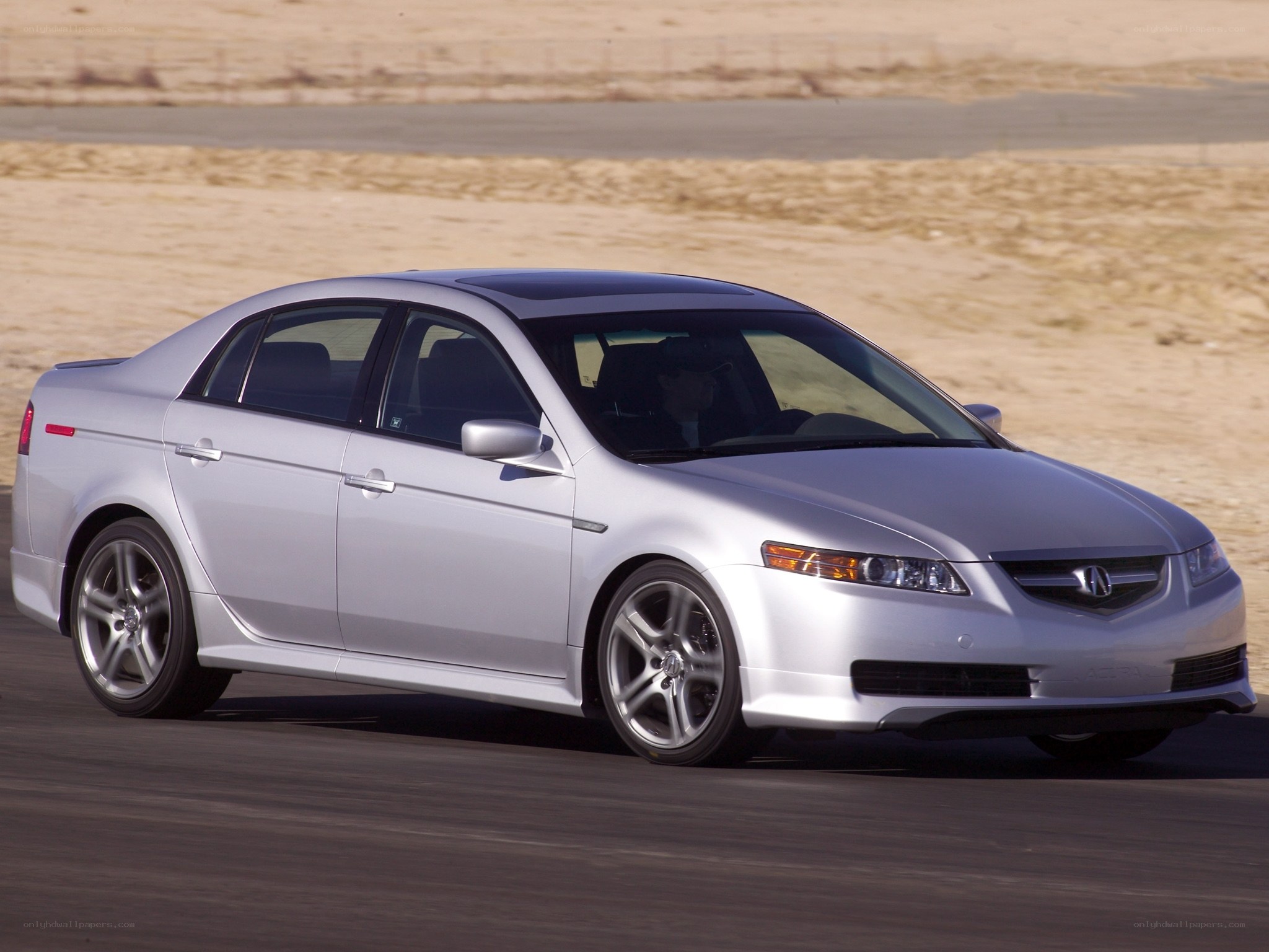 silver acura tl in motion