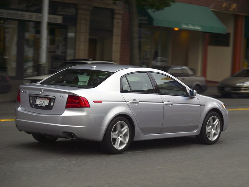 Silver Acura TL on city street