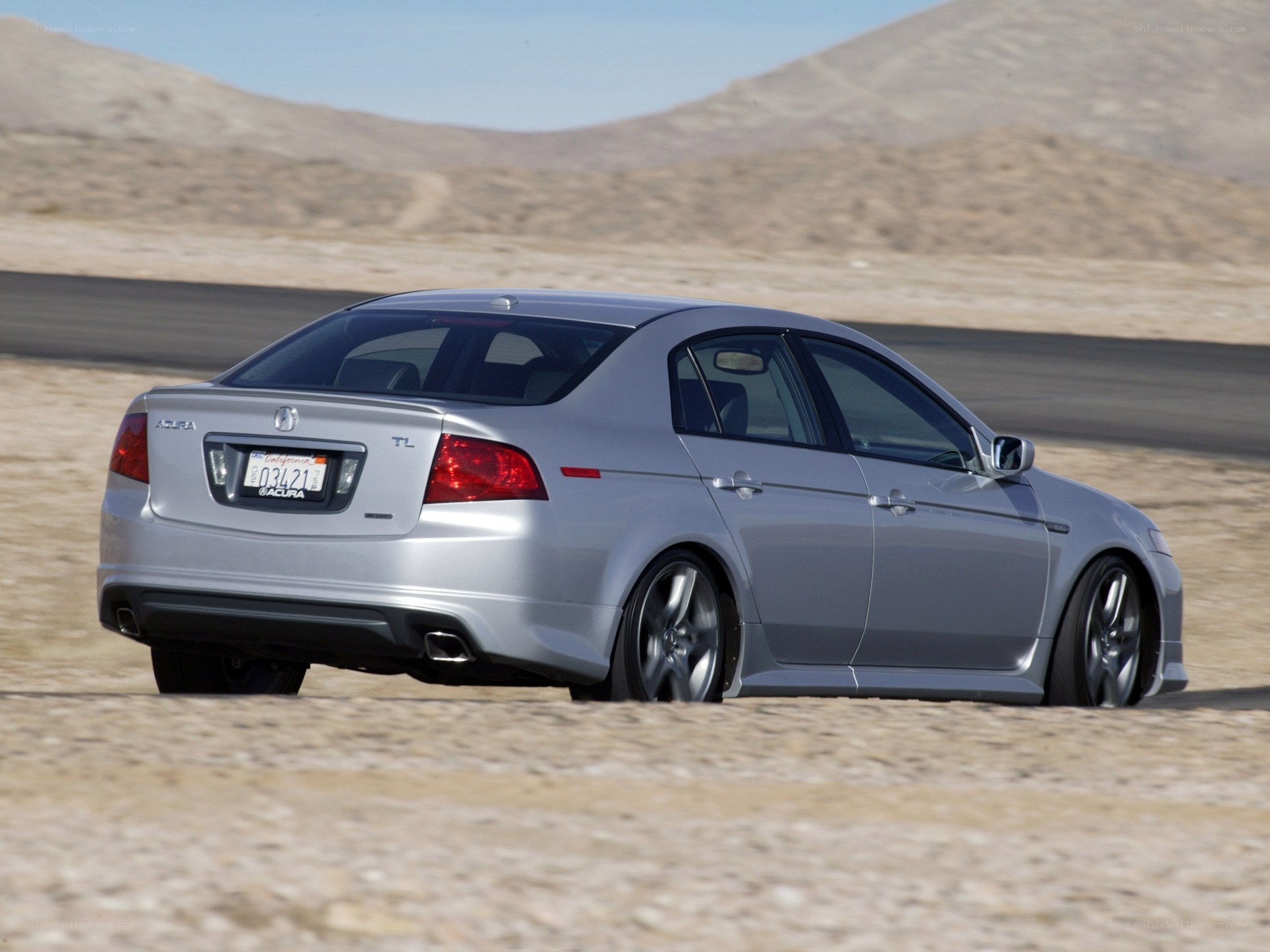 Silver Acura TL on desert road