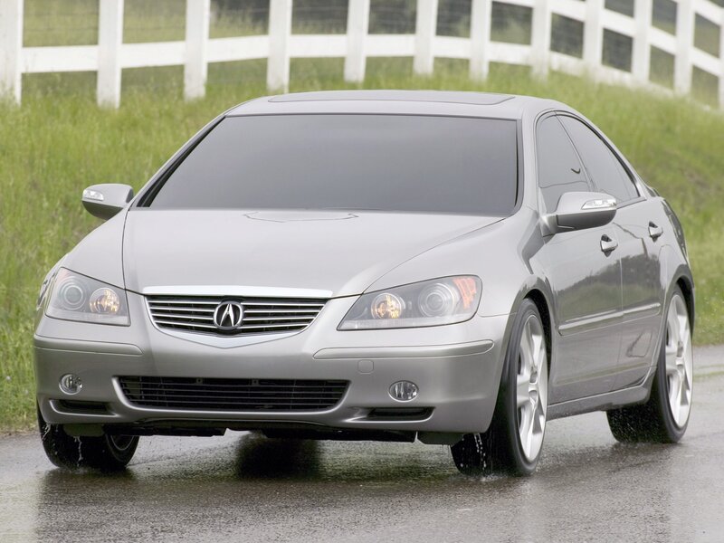 silver acura tl on wet road