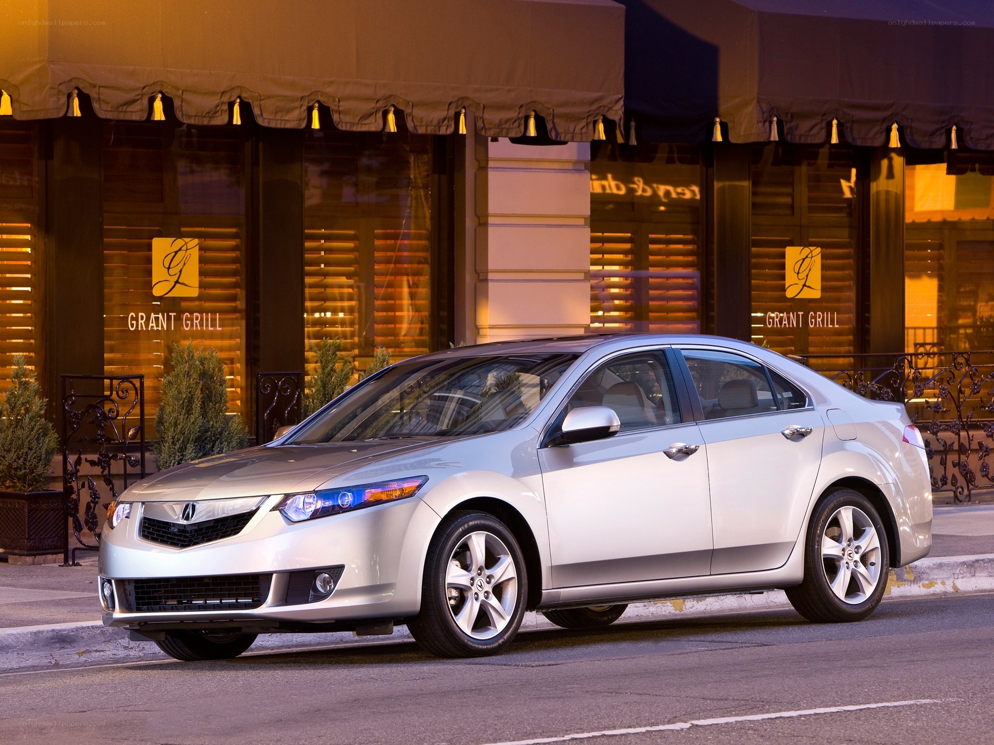 Silver Acura TL parked outside restaurant