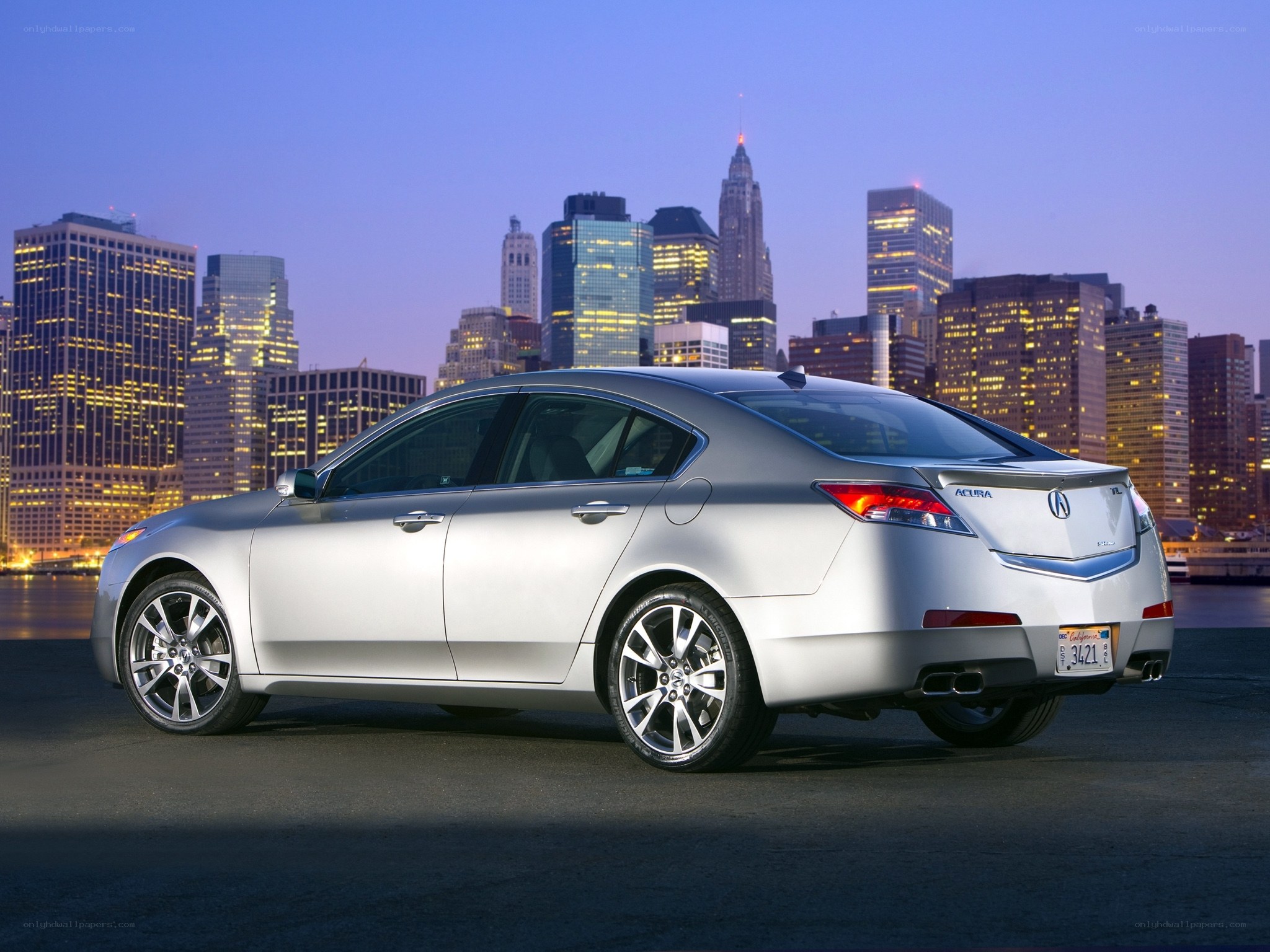 Silver Acura TL sedan at dusk