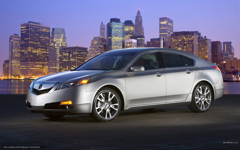 Silver Acura TL sedan at dusk