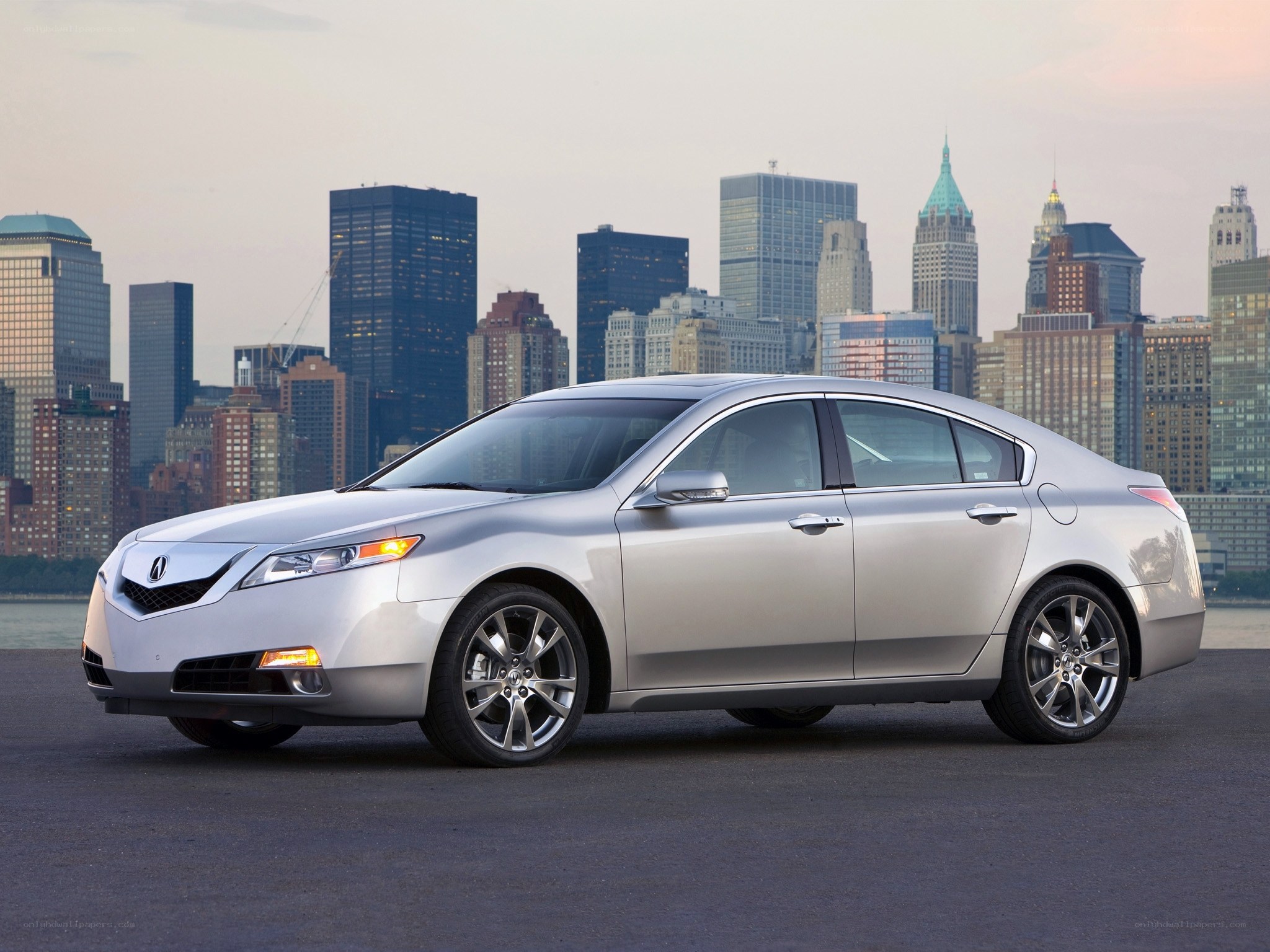 Silver Acura TL sedan in city