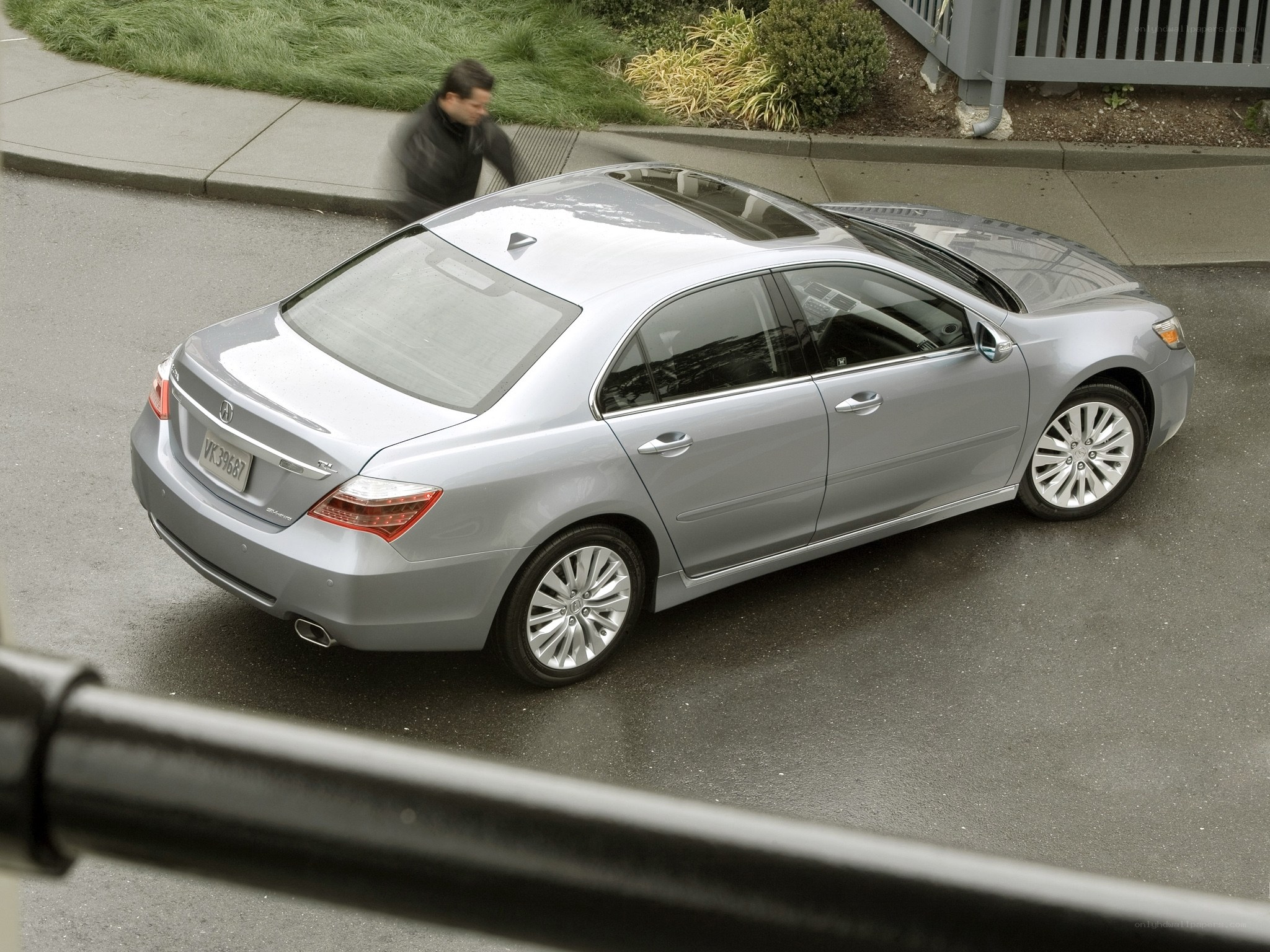Silver Acura TL sedan parked