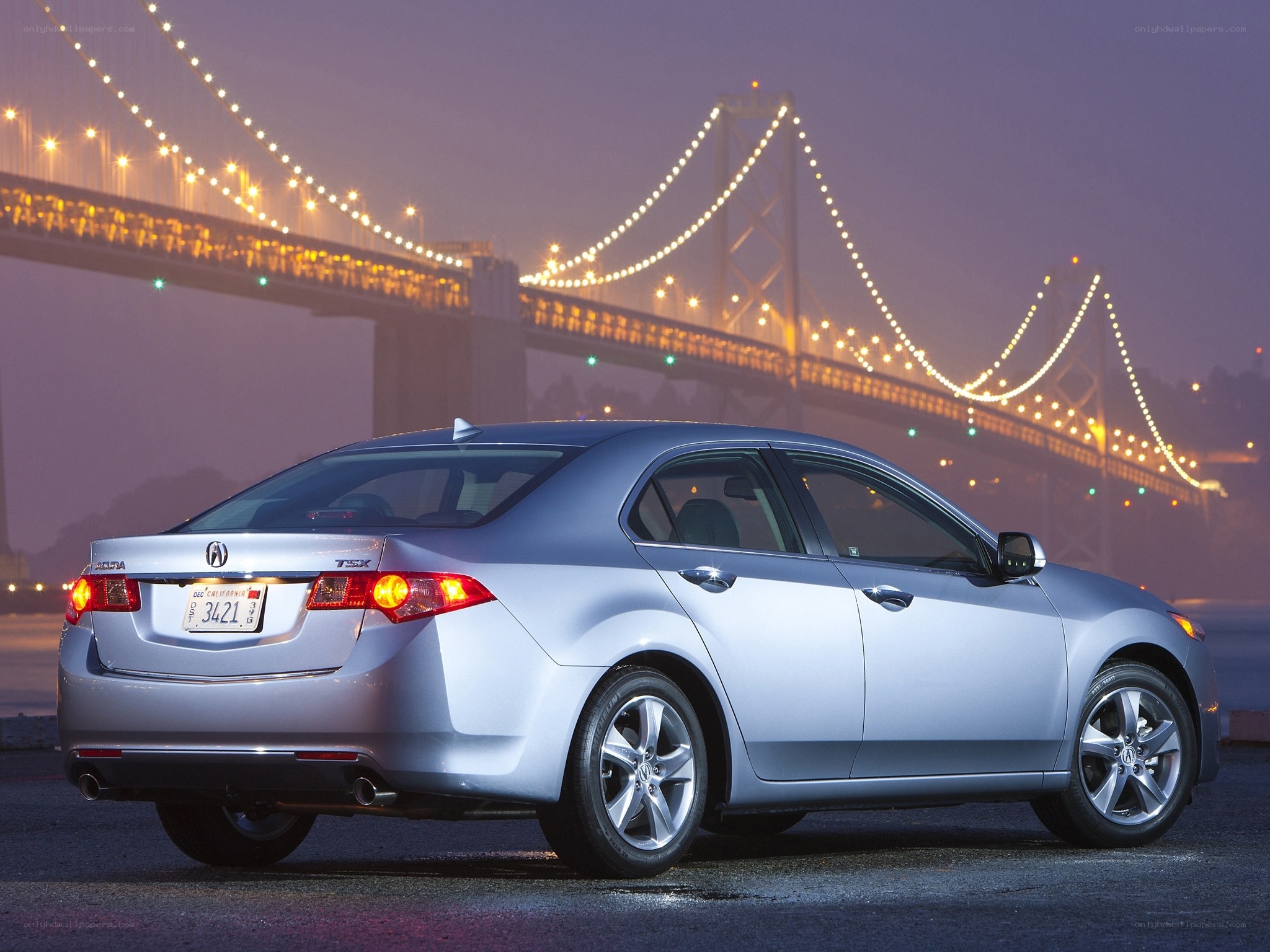 Silver Acura TSX at night
