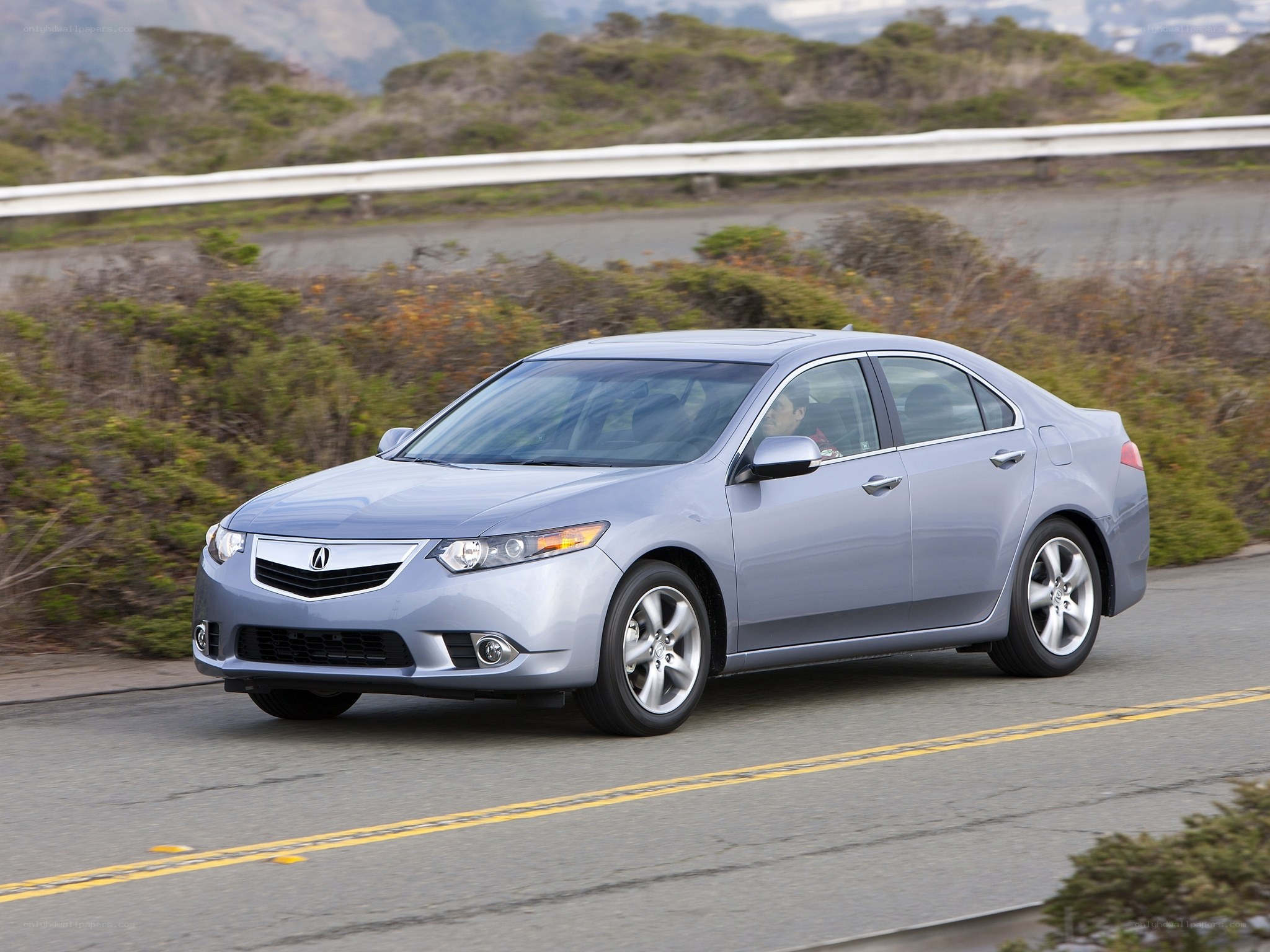 silver acura tsx driving on road