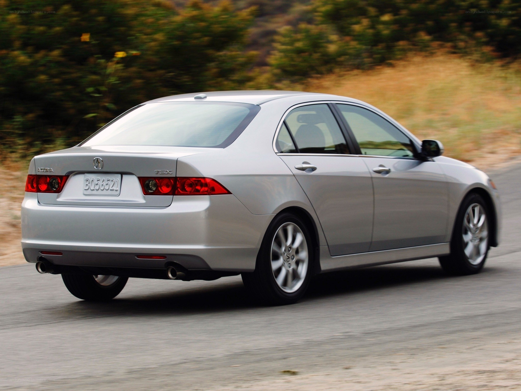 silver acura tsx driving