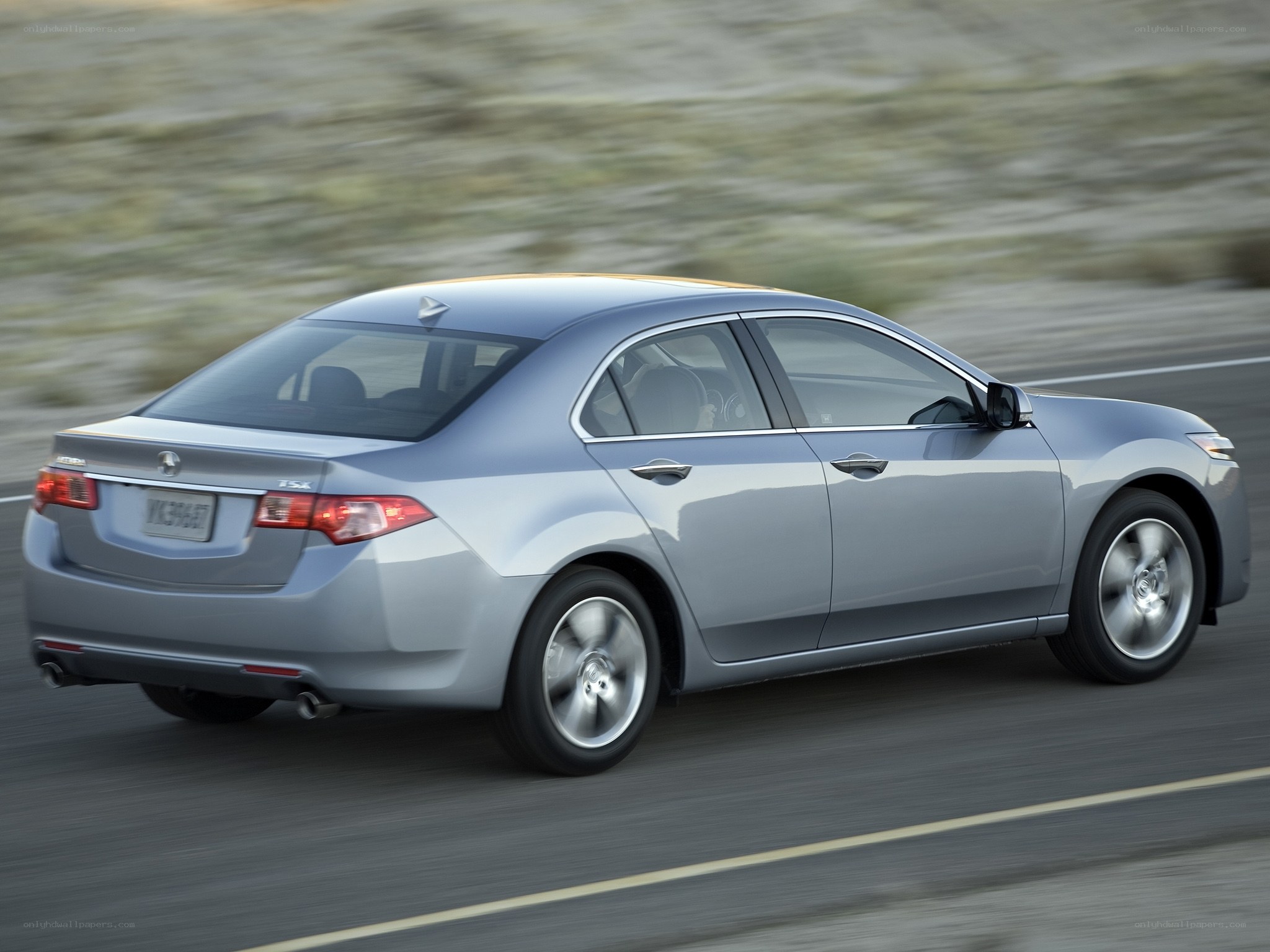 silver acura tsx in motion