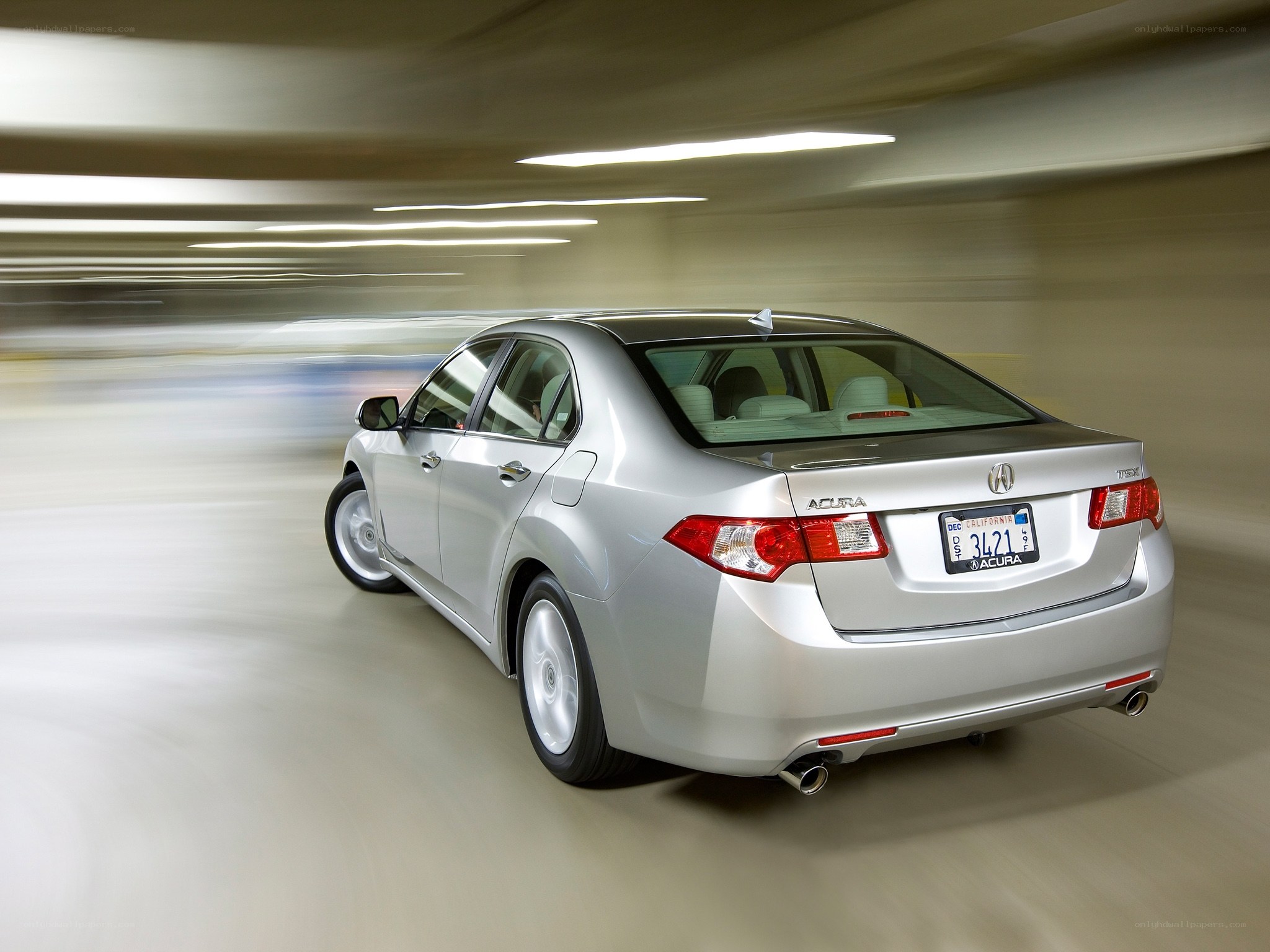 Silver Acura TSX in motion
