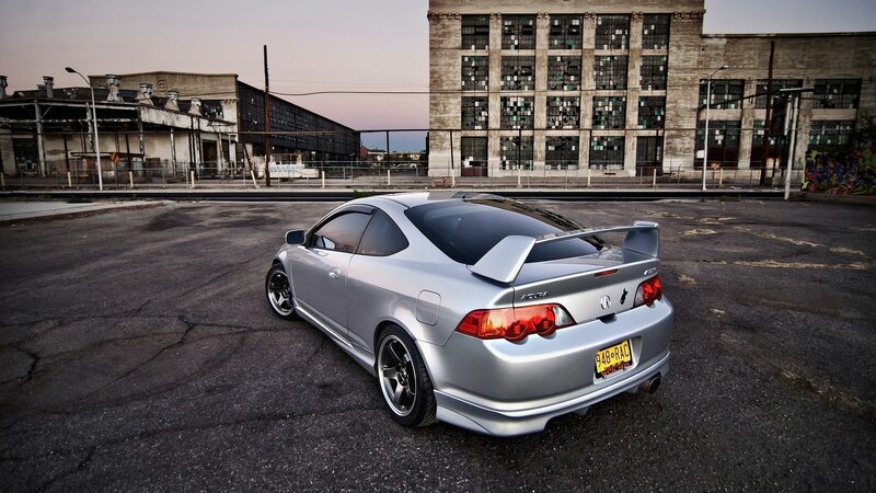 silver acura type s in industrial lot