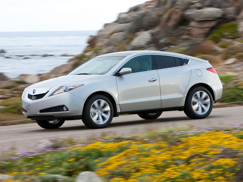 Silver Acura ZDX driving on coastal road