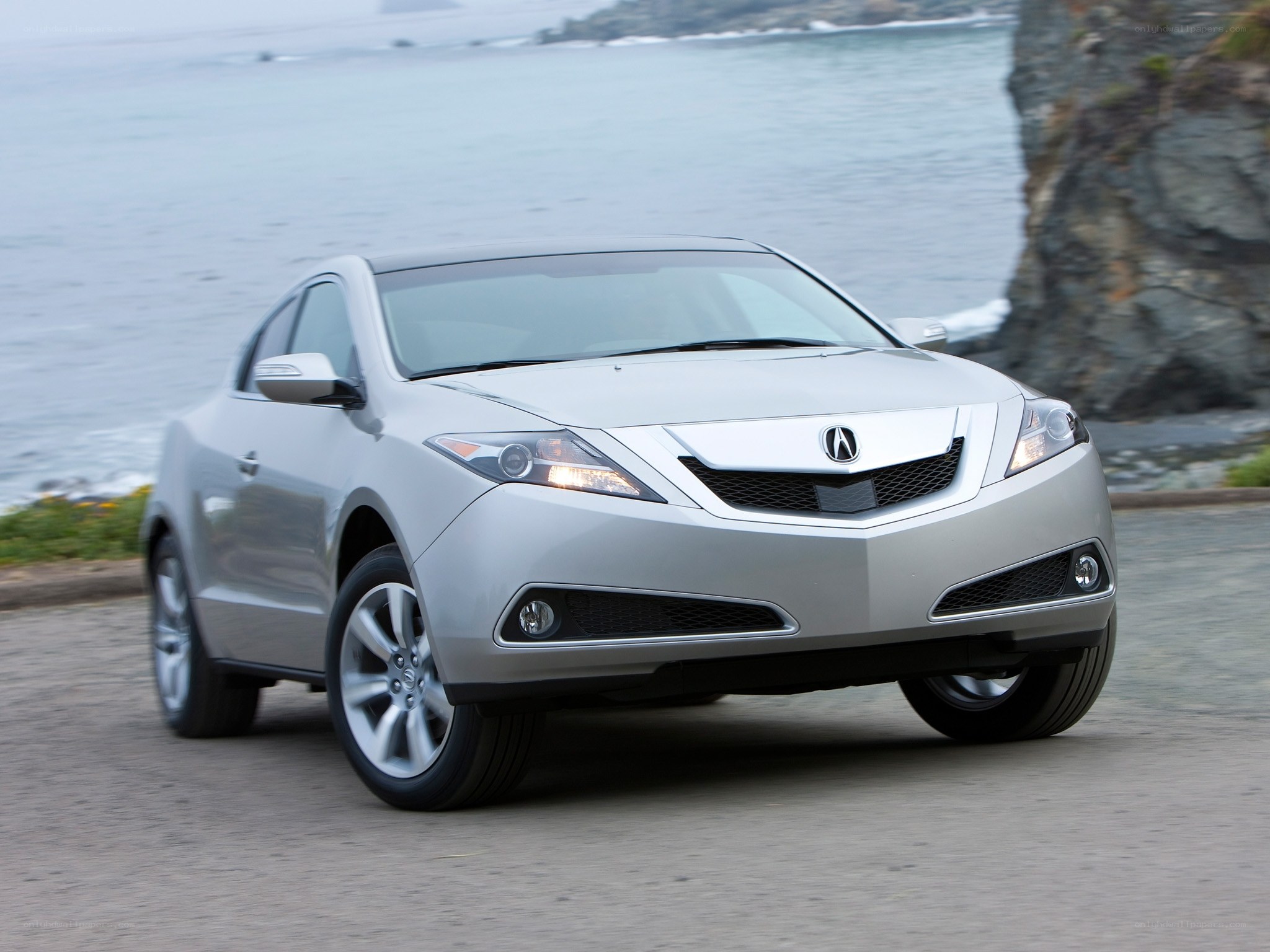 Silver Acura ZDX on coastal road