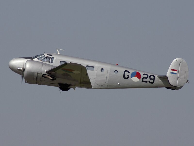 Silver aircraft in flight