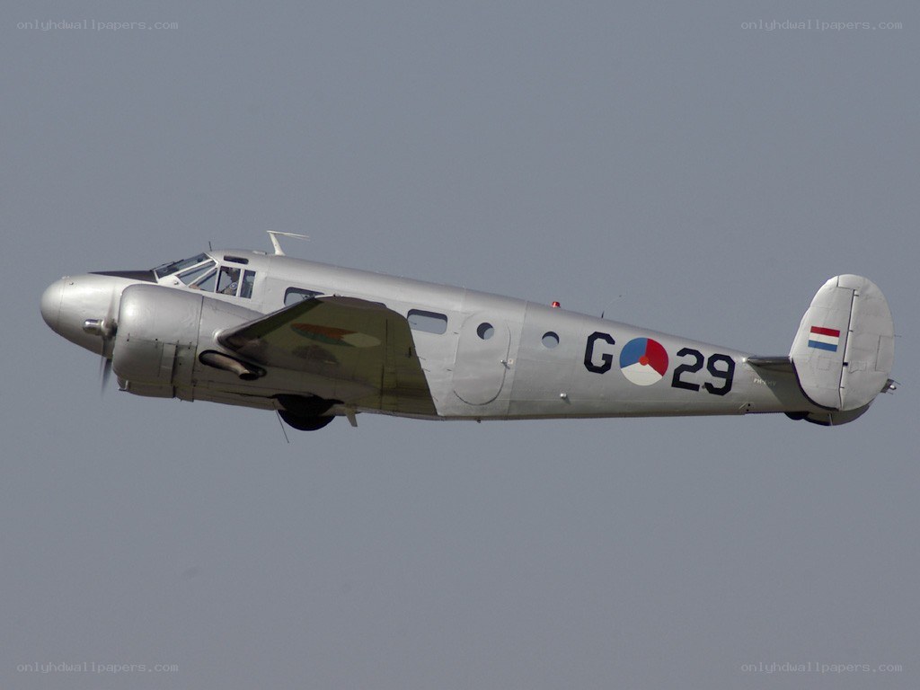 Silver aircraft in flight
