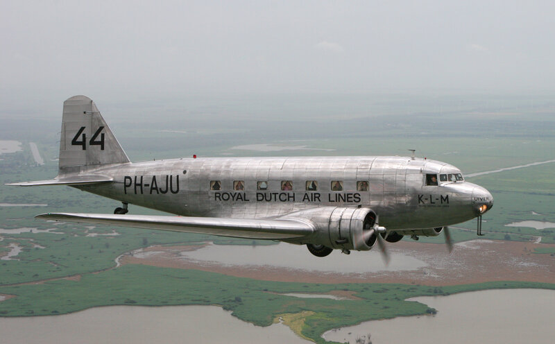 Silver Airplane in Flight — Gray