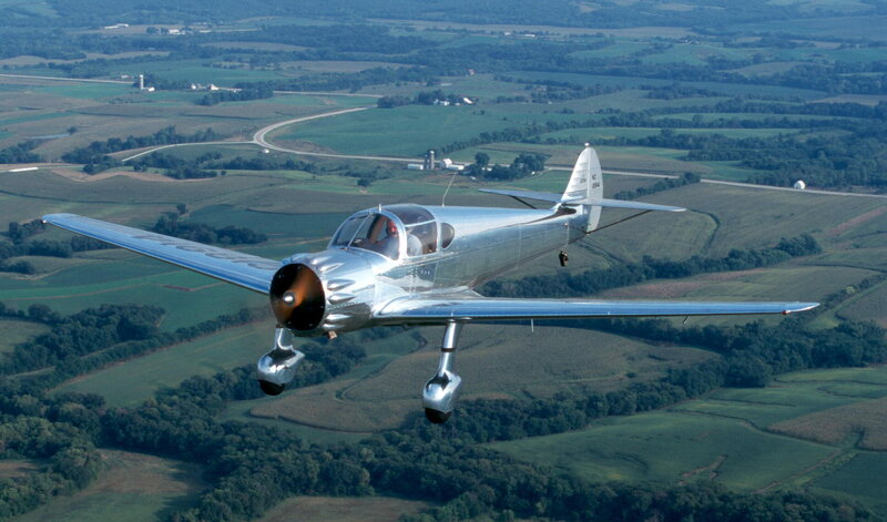 Silver Airplane in Flight — Green