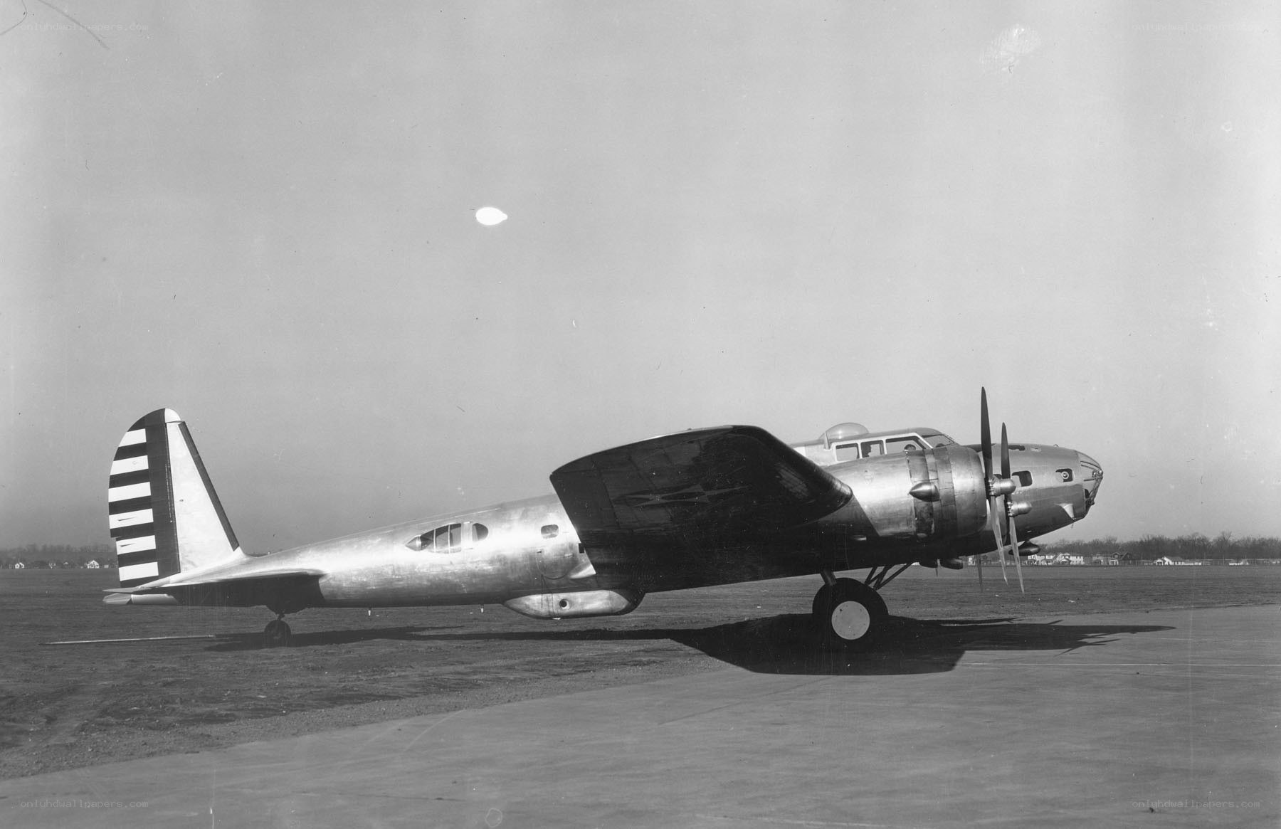 Silver airplane on tarmac