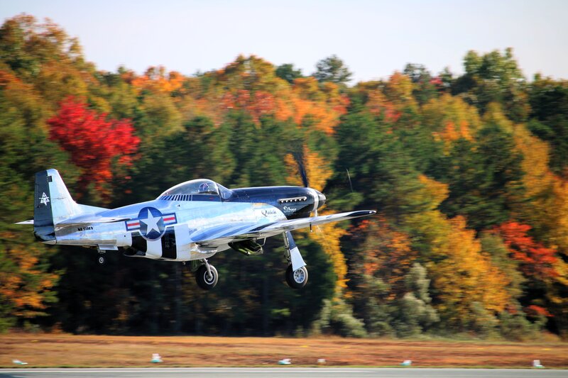 Silver Airplane Taking Off