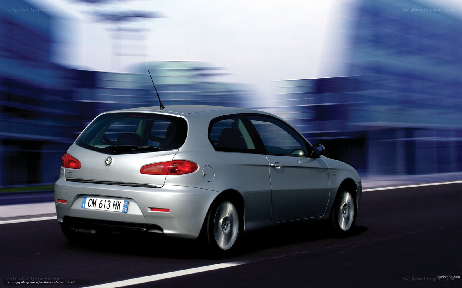 silver alfa romeo 147 in motion