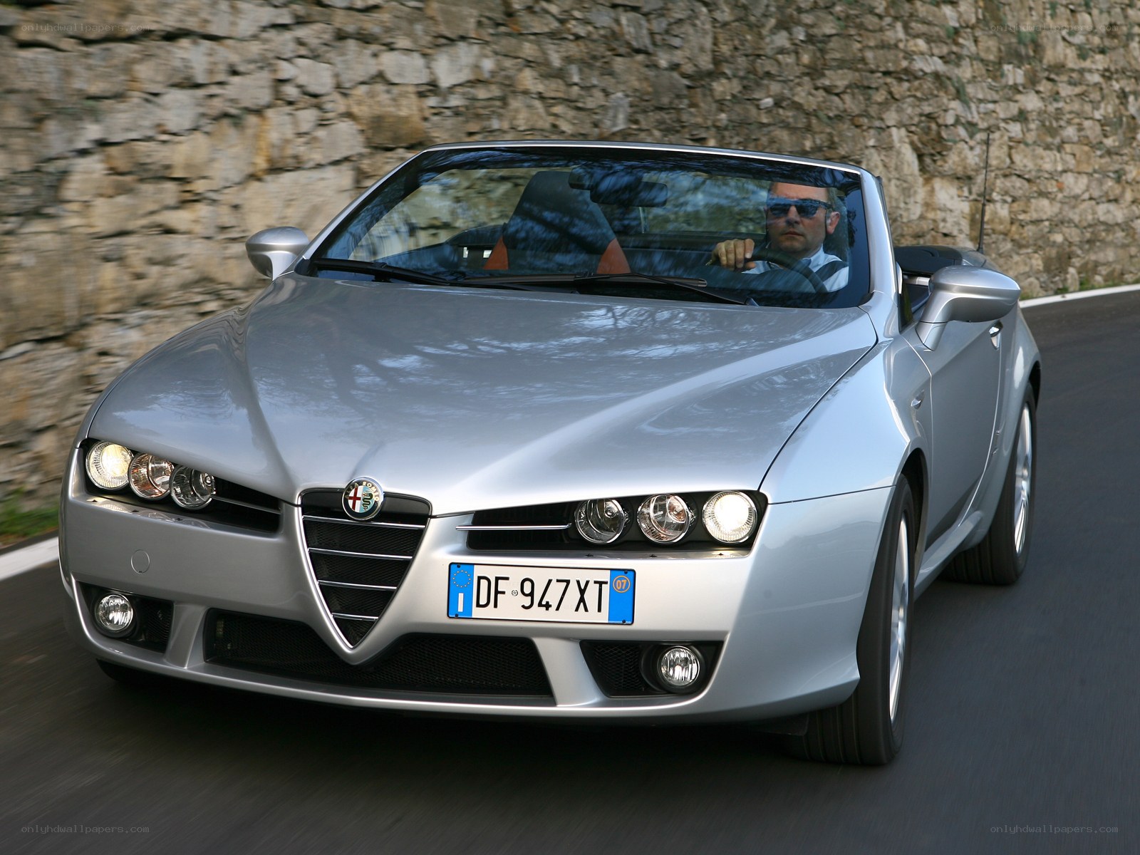 Silver Alfa Romeo convertible driving