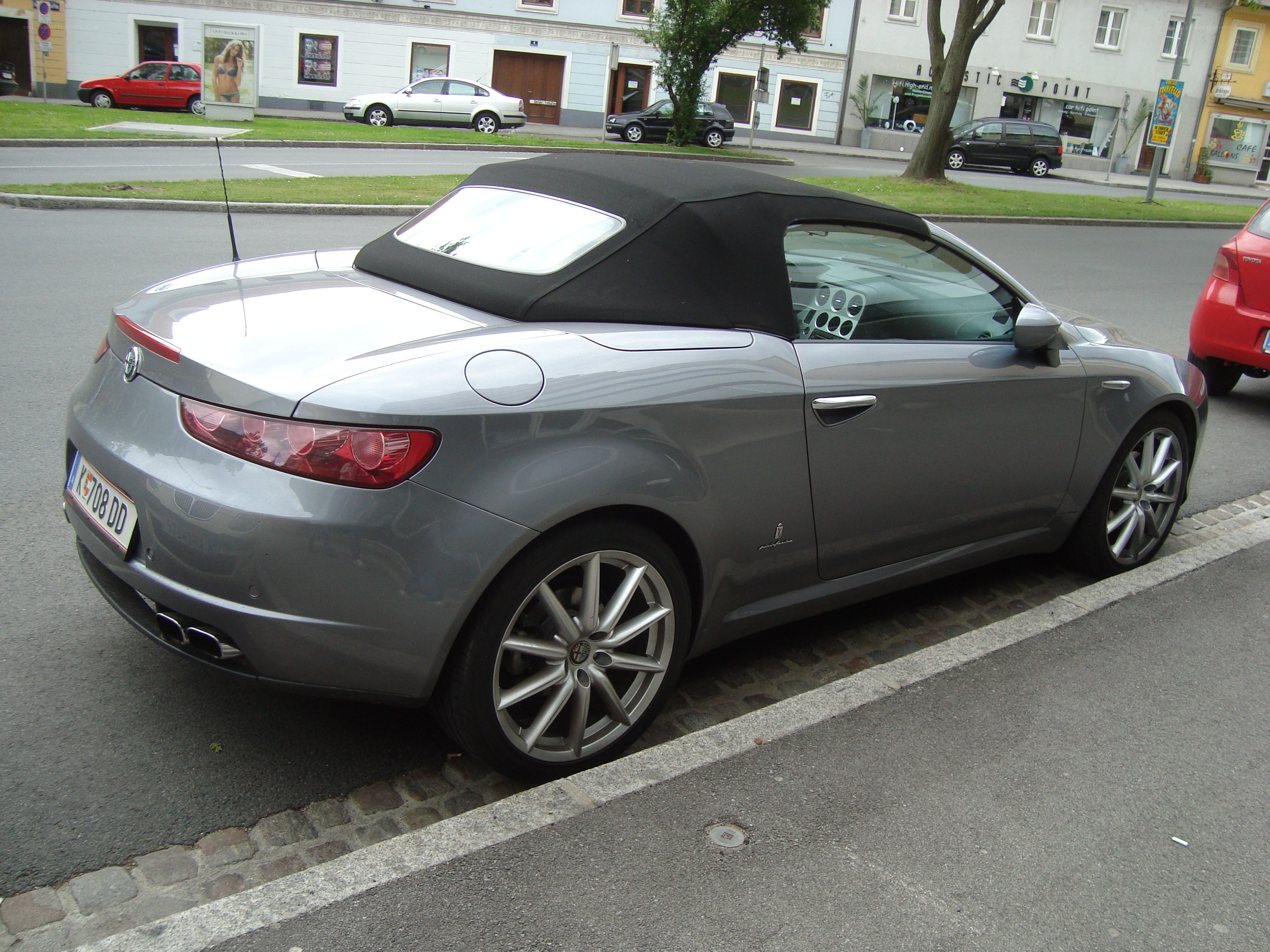 silver alfa romeo convertible parked
