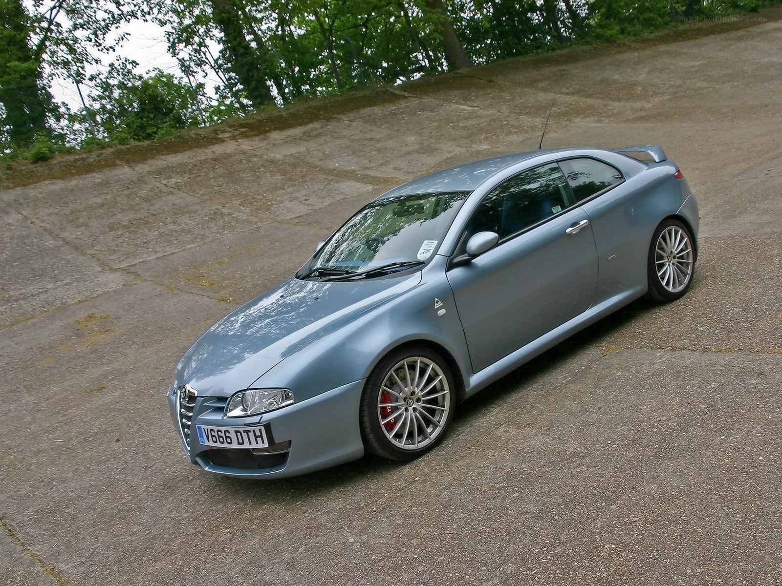 silver alfa romeo coupe