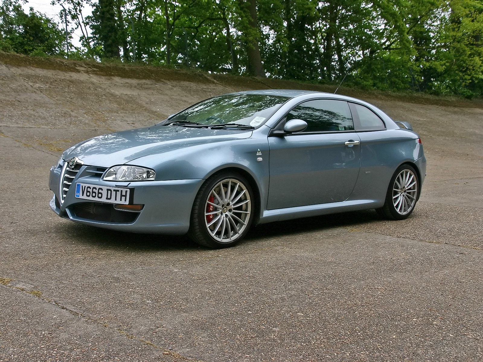 silver alfa romeo coupe