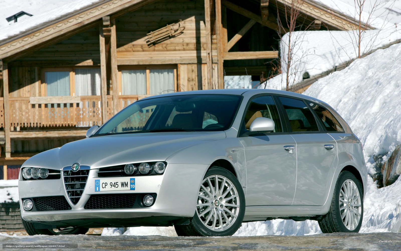 Silver Alfa Romeo in snowy setting