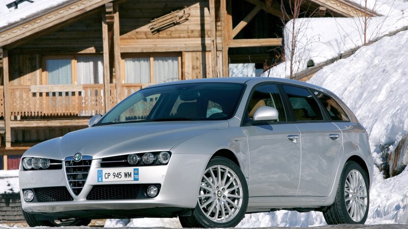 Silver Alfa Romeo in snowy village