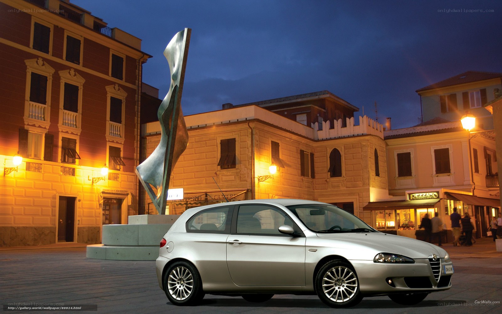 Silver Alfa Romeo in town square