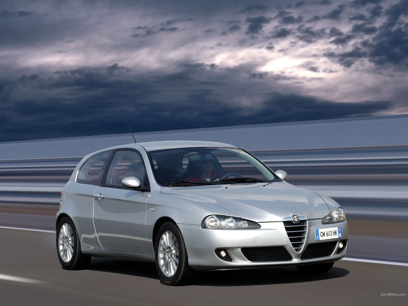 silver alfa romeo on a road