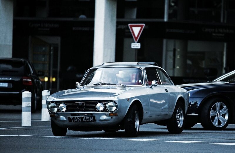 Silver Alfa Romeo on city street