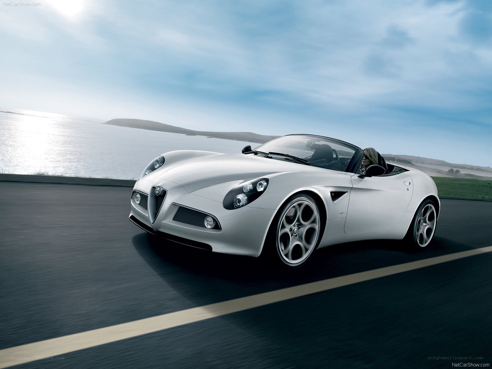 silver alfa romeo spider driving
