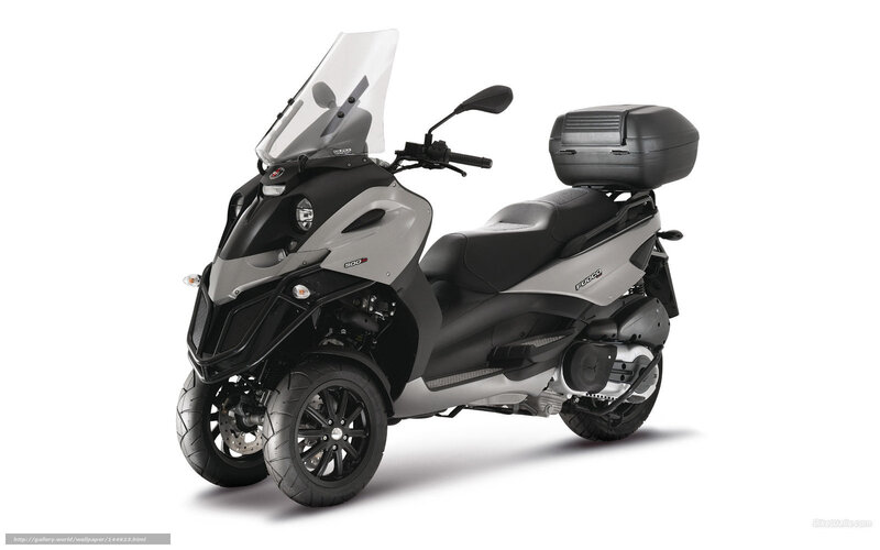 Silver and black three-wheeled scooter