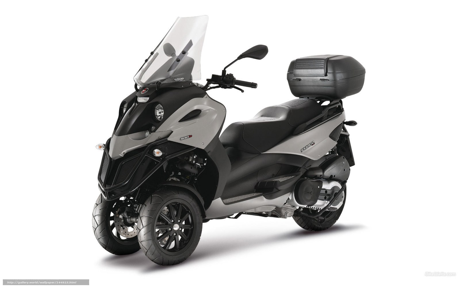 Silver and black three-wheeled scooter