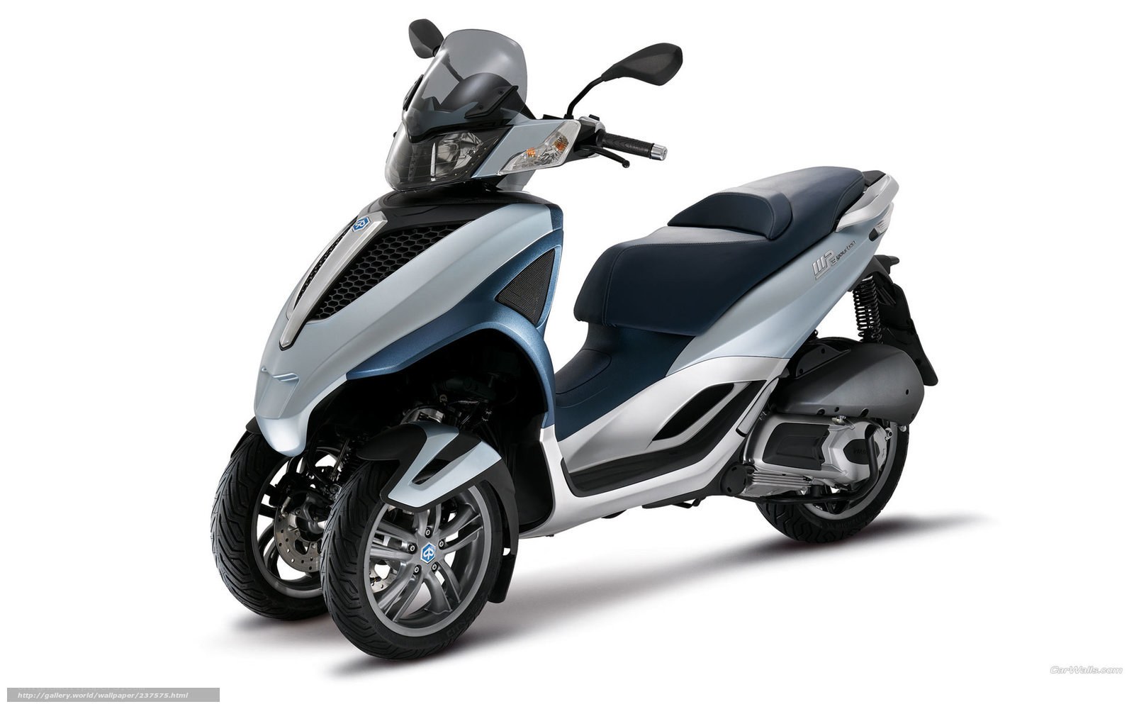 Silver and blue three-wheeled scooter