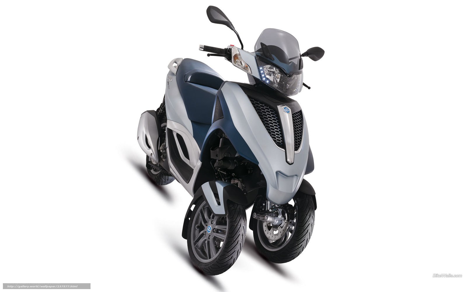 Silver and blue three-wheeled scooter