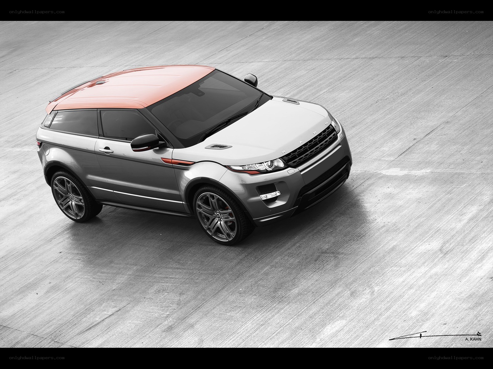 silver and orange SUV on concrete