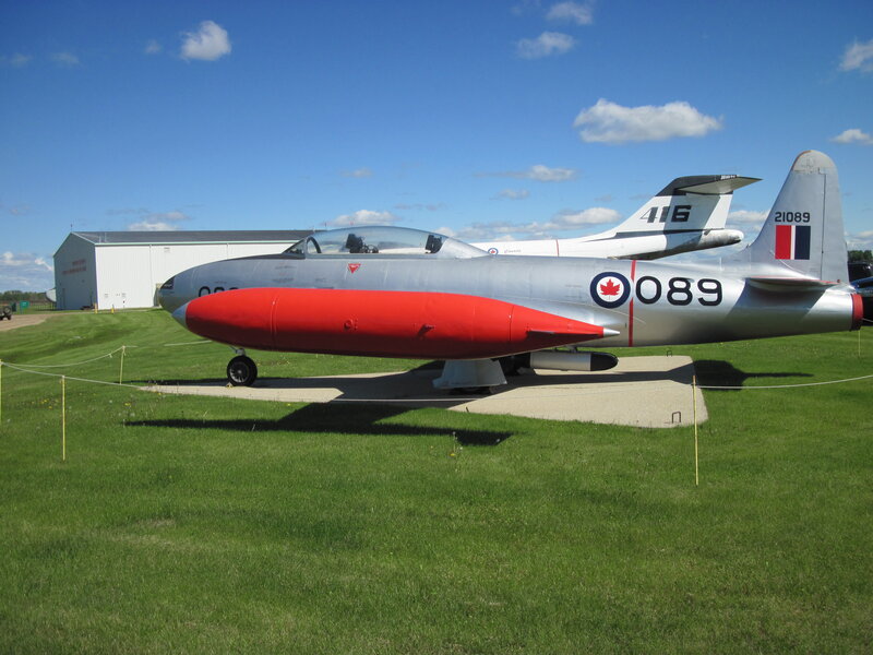 Silver and Red Jet Aircraft — Green