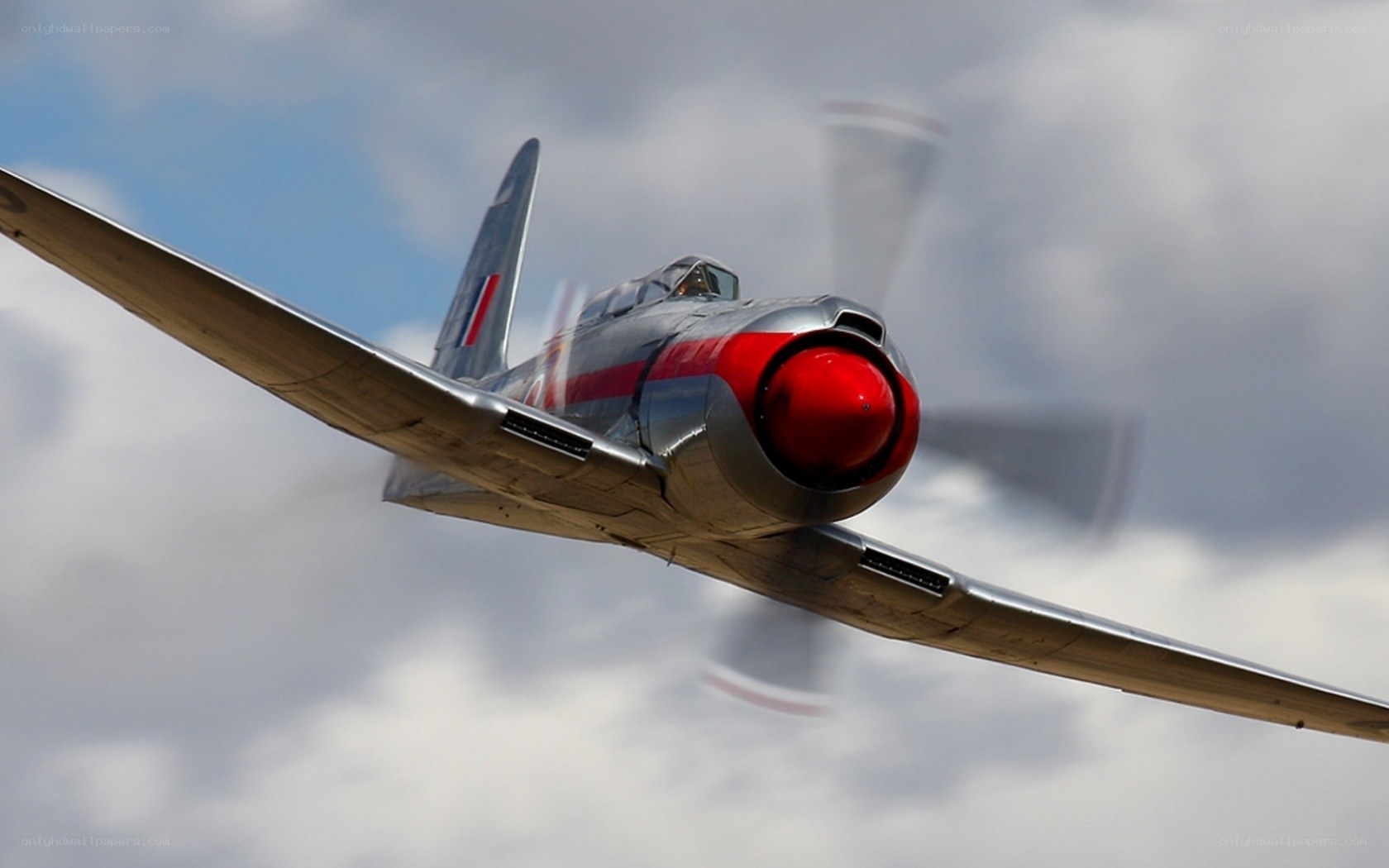 silver and red vintage airplane