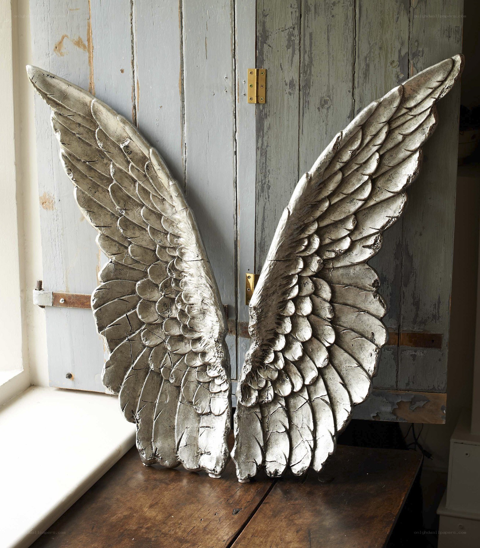 silver angel wings sculpture