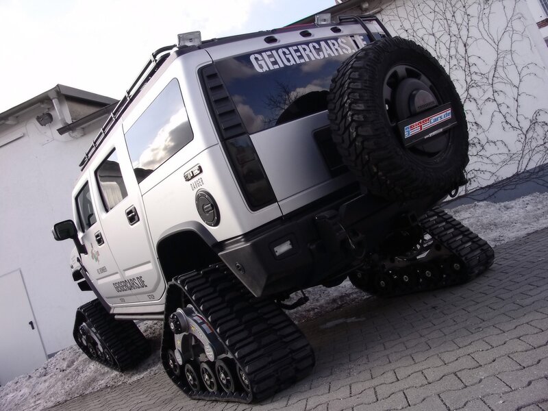silver armored vehicle with tracks