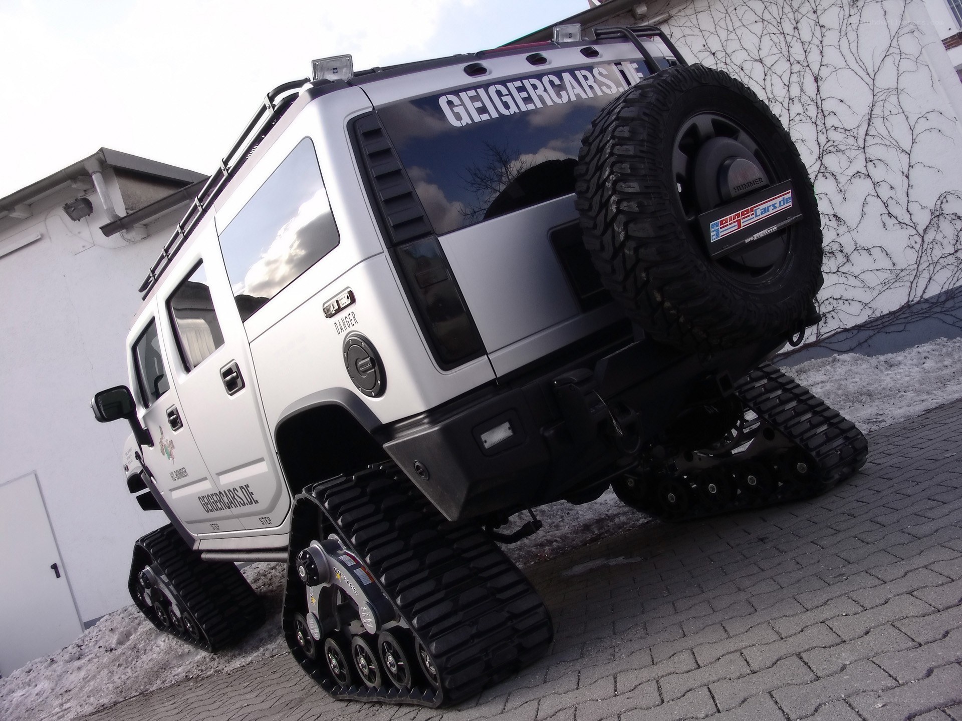silver armored vehicle with tracks